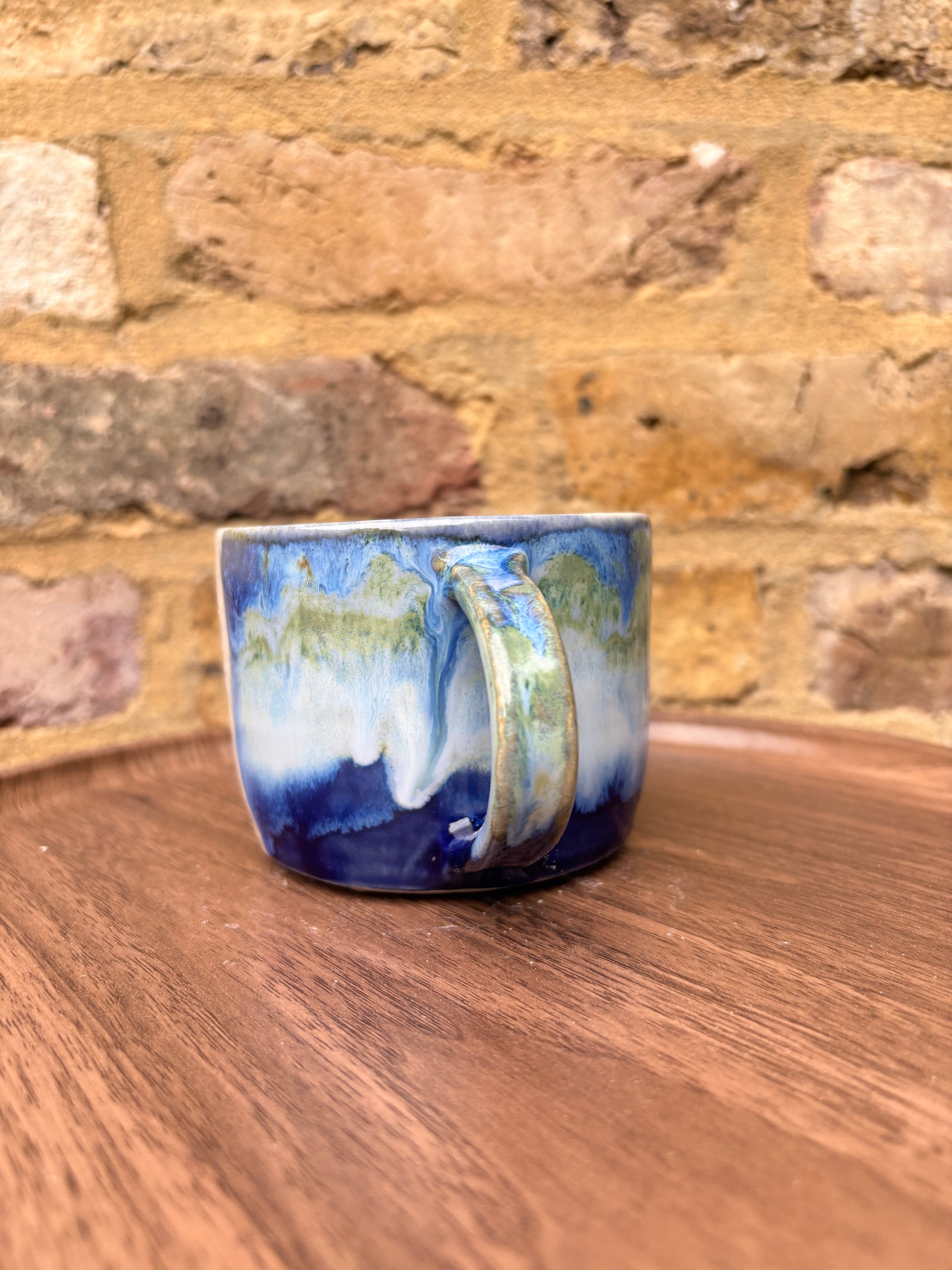 “What” “the fuck” mug (cream, blue/green)