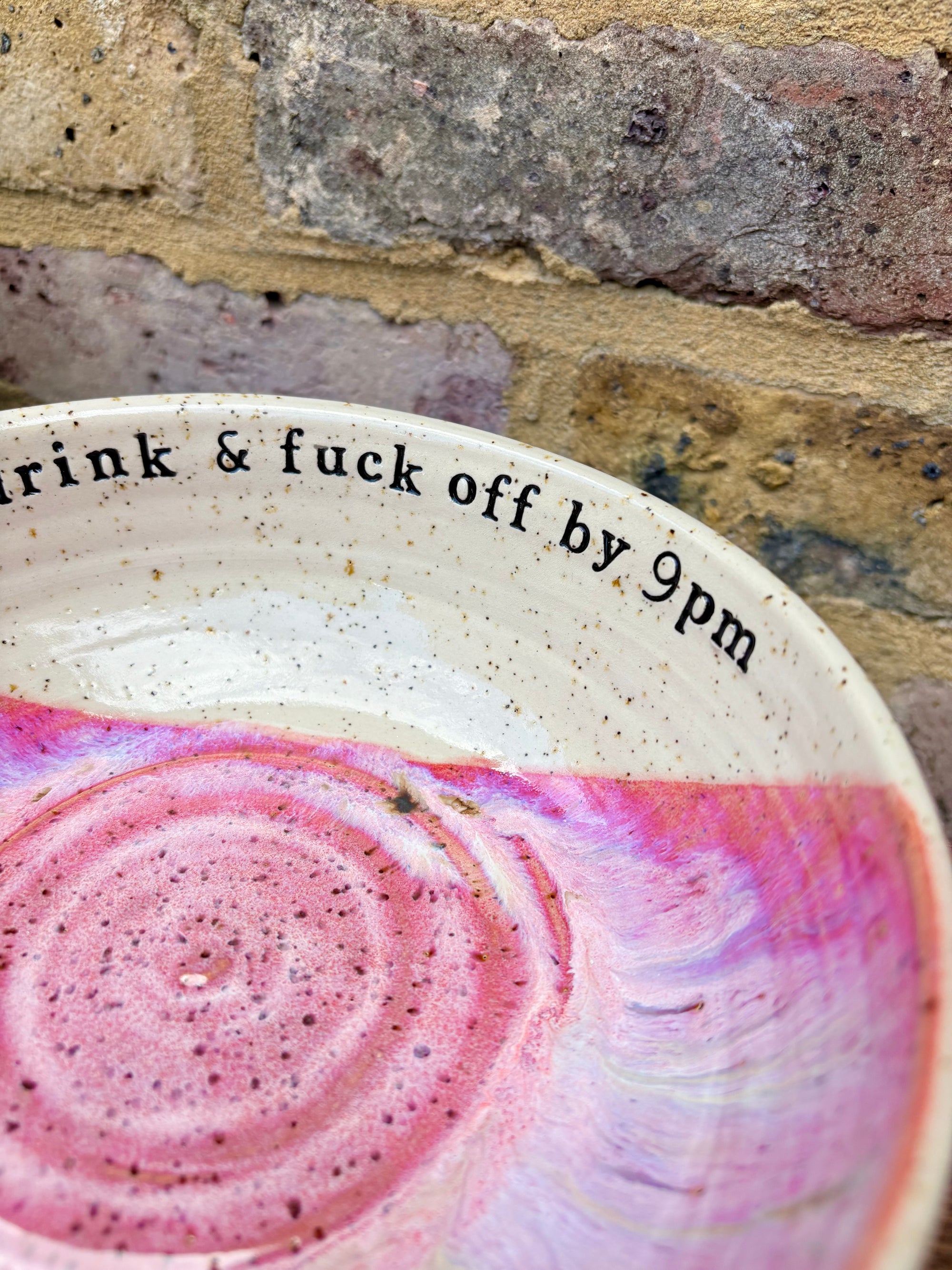 “eat, drink and fuck off by 9pm"  deep round salad/pasta bowl (pink, flecked clay)