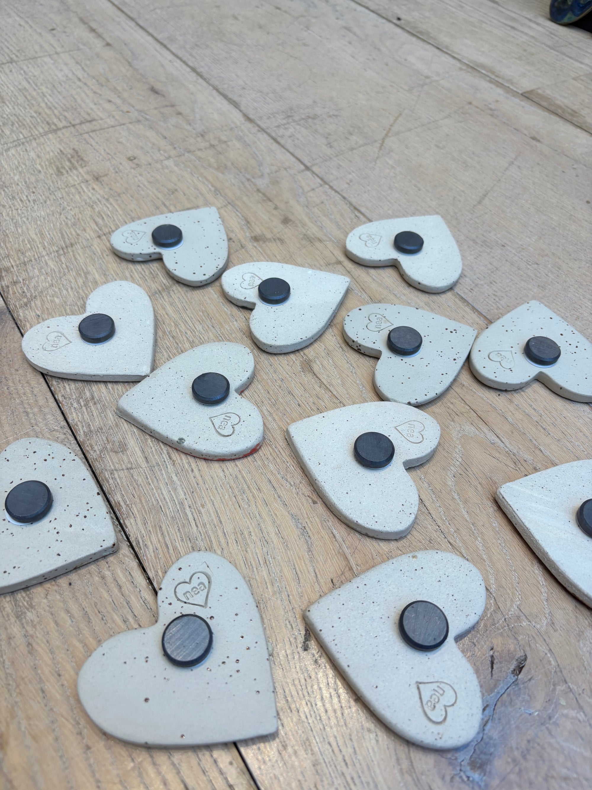 Twelve heart shaped Taylor Swift album magnets