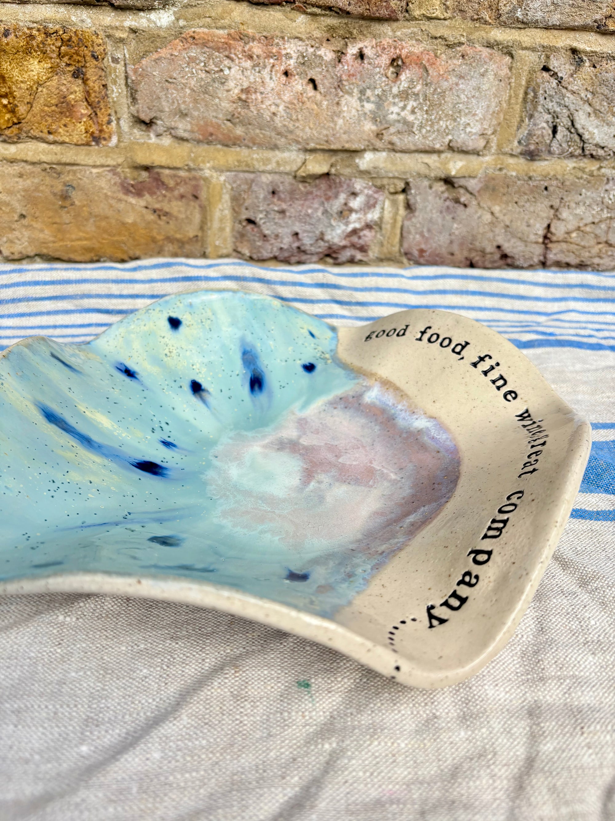 "good food, fine wine, great company..." serving dish