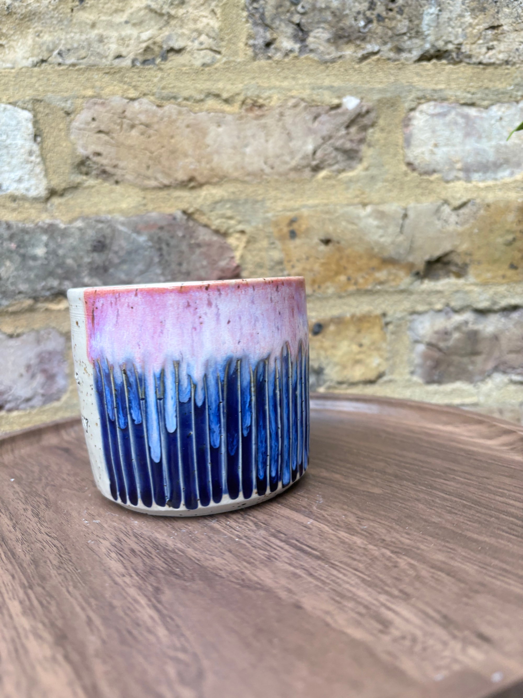 Large “A book a day keeps reality away" mug (pink sky)