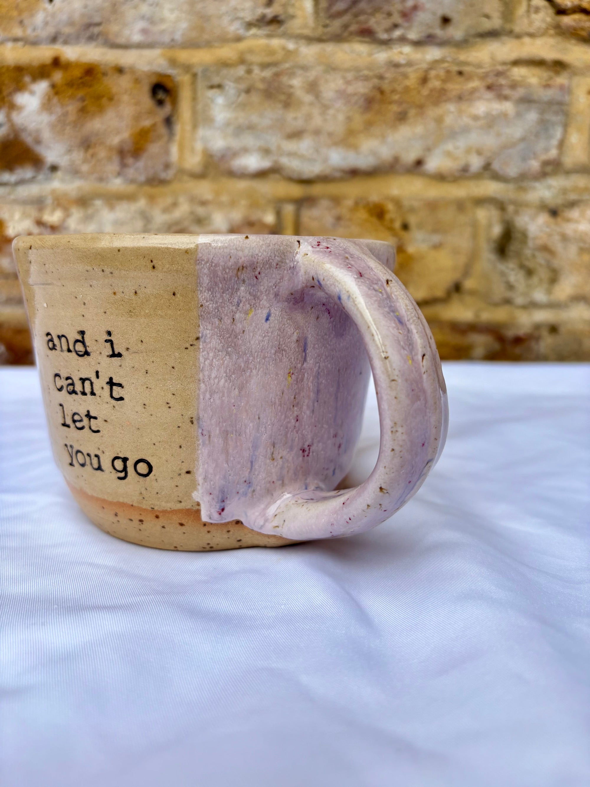 “and I can't let you go”, and "your handprint's on my soul" mug