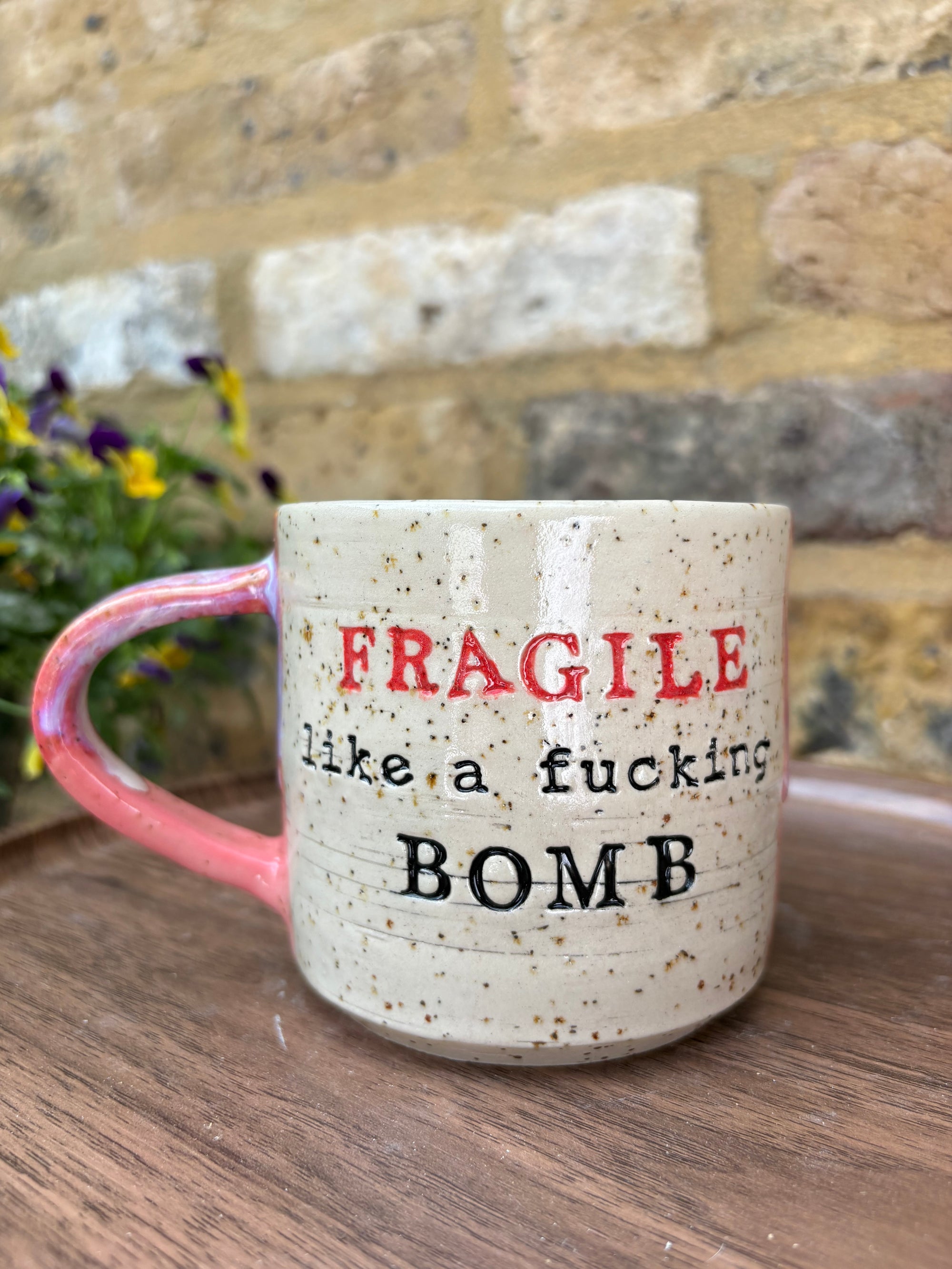"FRAGILE like a fucking bomb" mug (pink, flecked, red FRAGILE)