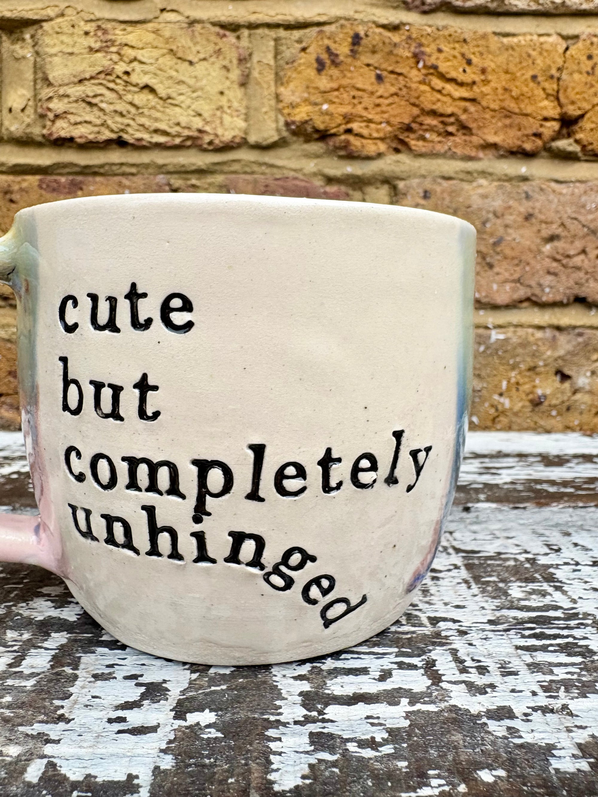 "cute but completely unhinged" mug