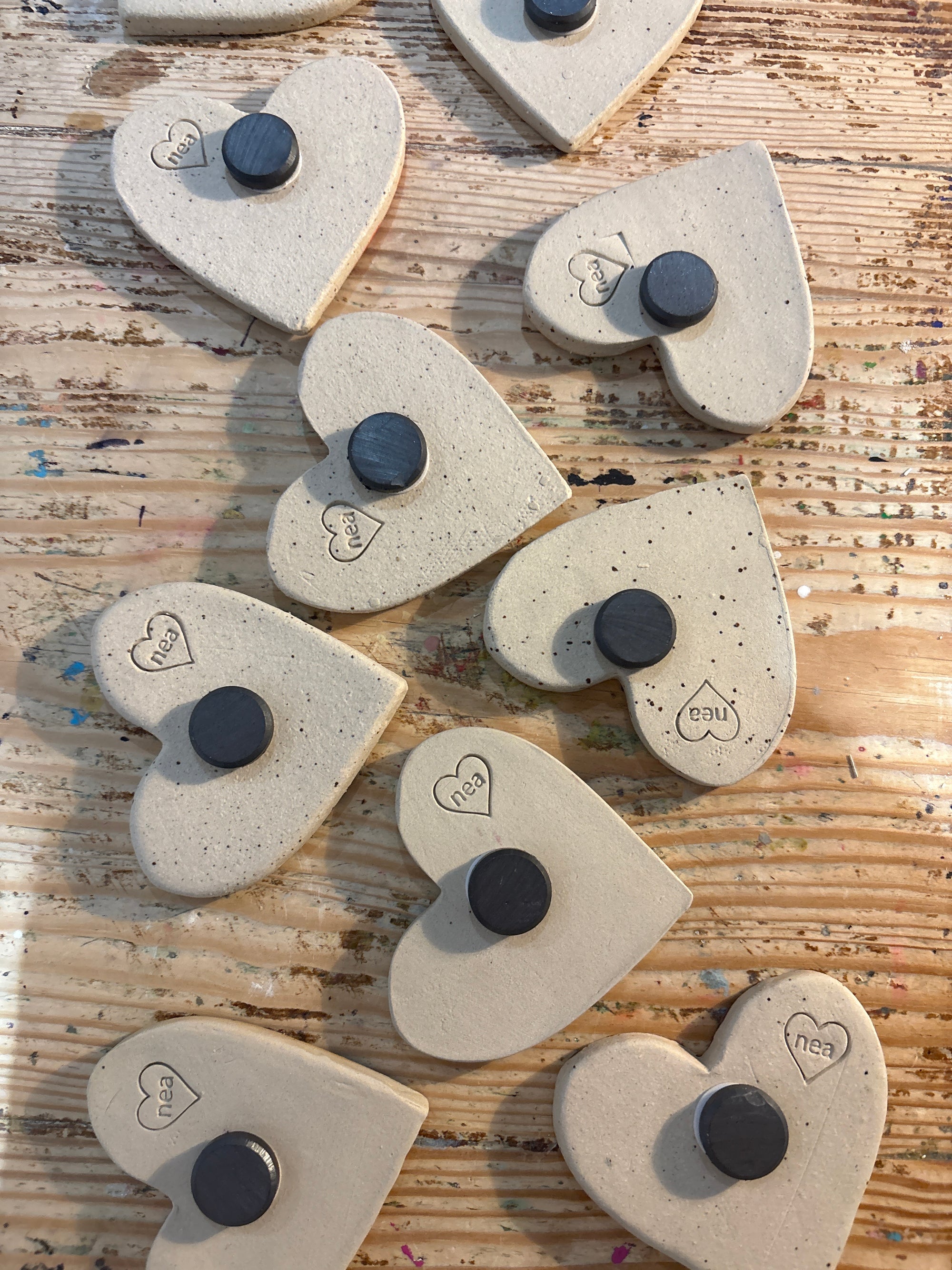 Twelve heart shaped Taylor Swift album magnets