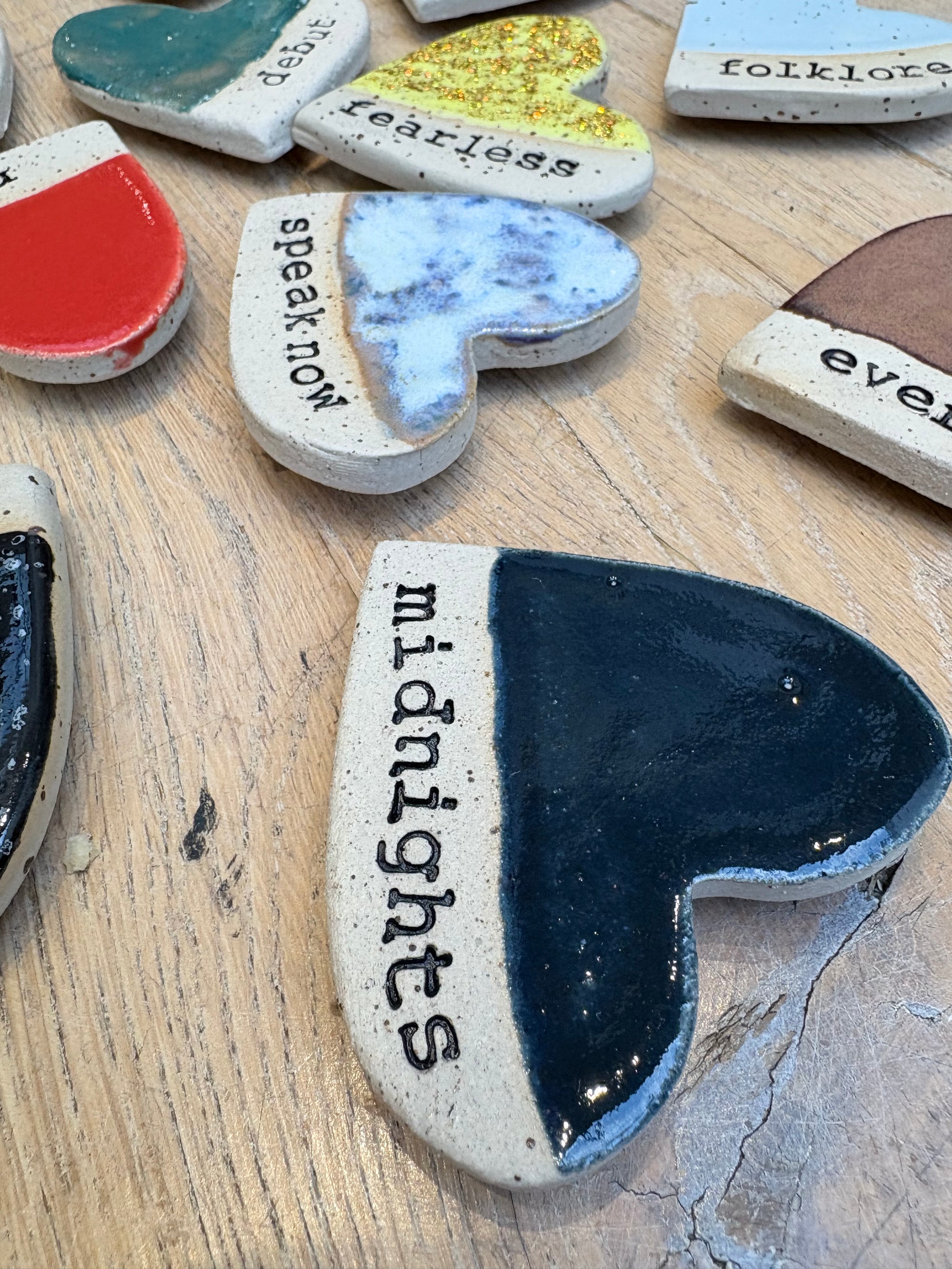 Twelve heart shaped Taylor Swift album magnets