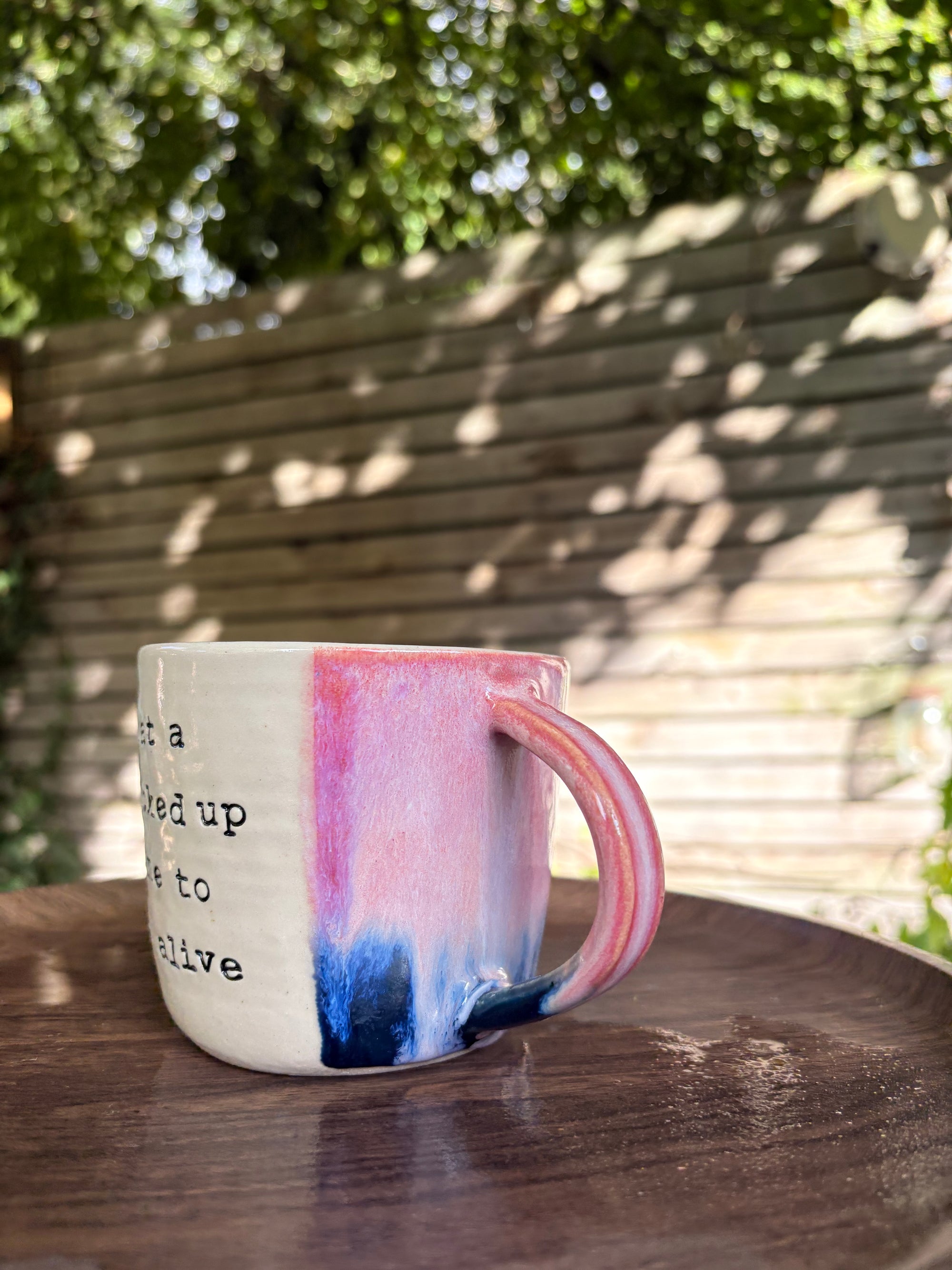 "what a fucked up time to be alive" mug (Pink/blue)