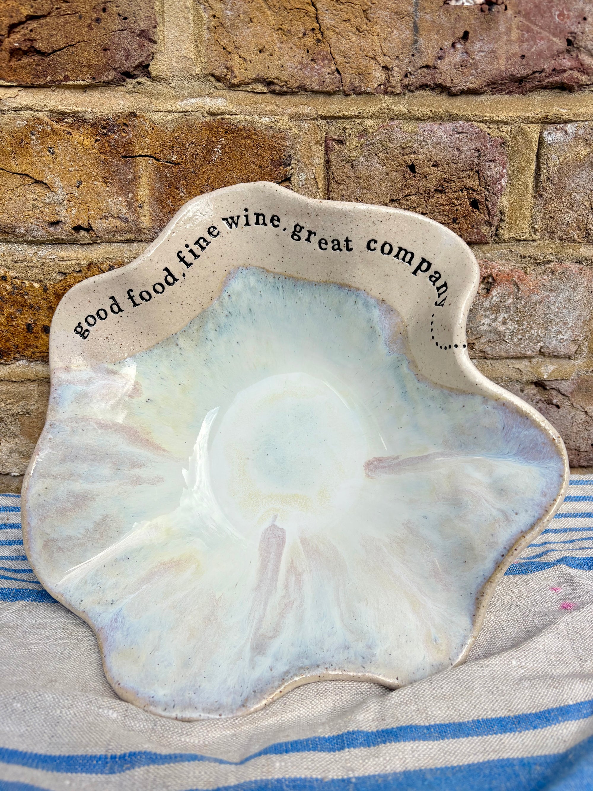 "good food, fine wine, great company..." serving dish